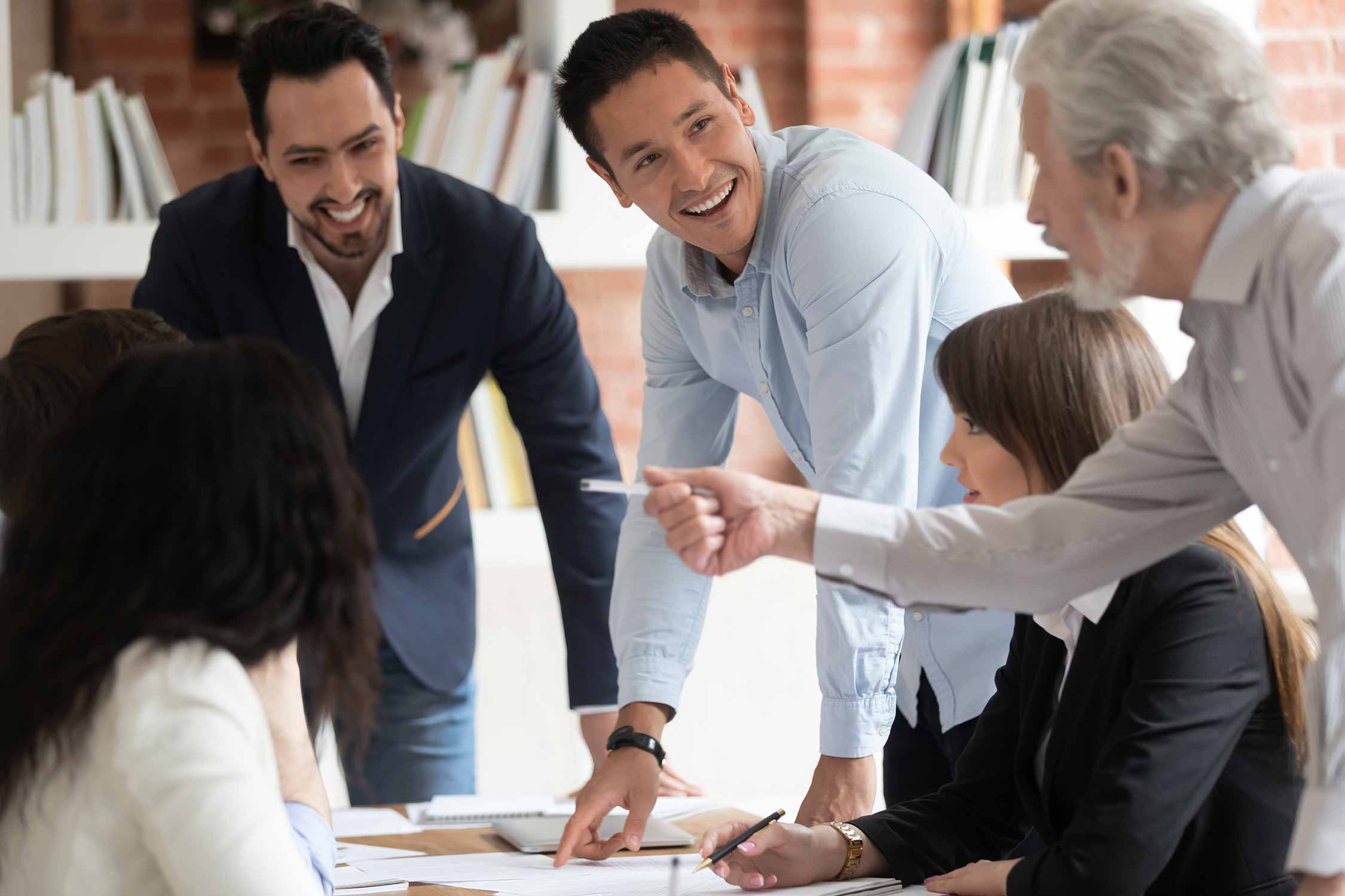 People sitting together around a table and having a meeting